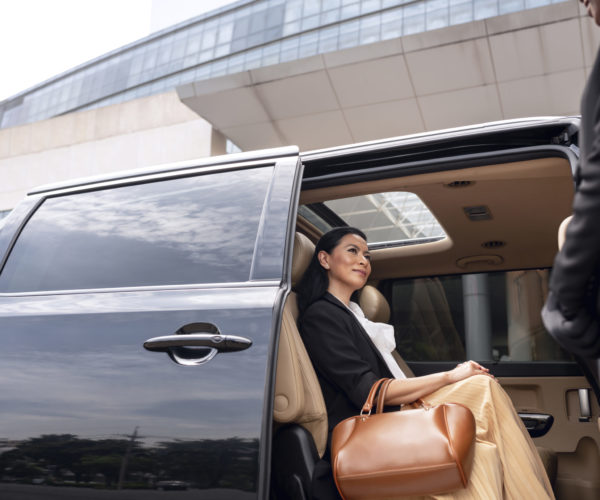 businesswoman-getting-in-taxi-cab businesswoman-getting-in-taxi-cab